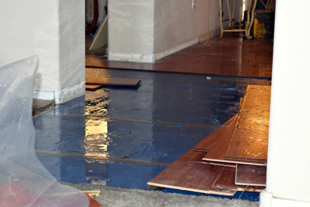 Professional Flood Damage Restoration technician working in Orange, MA